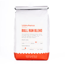 Load image into Gallery viewer, White coffee bag with red text and design, featuring 'Bull Run Blend' from Water Avenue Coffee.
